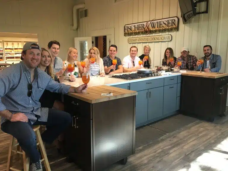 Group of people around island at Fischer & Wieser cooking school